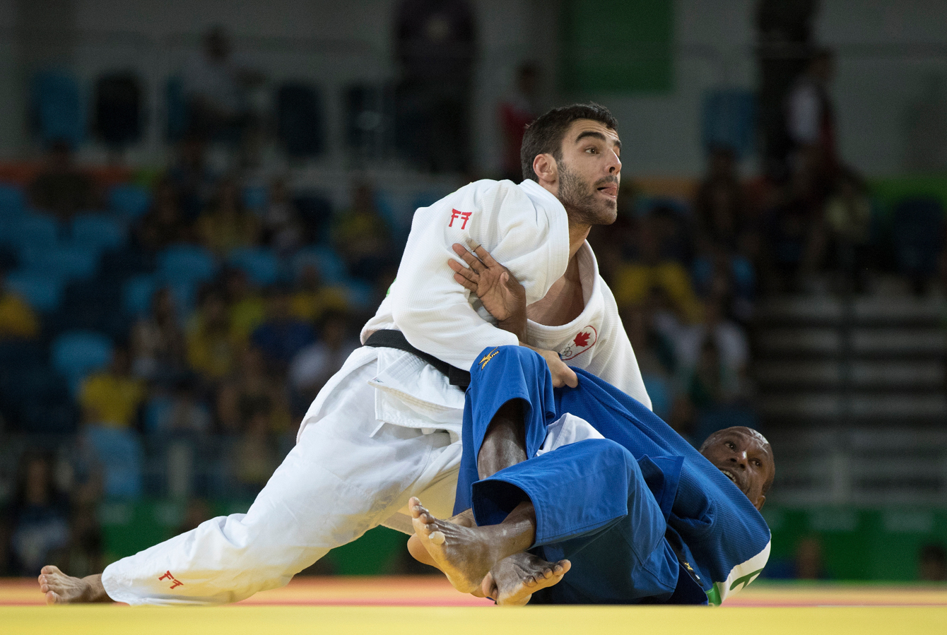 Canada's Antoine Bouchard takes on Raymond Ovinou of Papua New Guinea during Men's 66kg Judo action at the Olympic games in Rio de Janeiro, Brazil, Sunday, August 7, 2016. COC Photo by Jason Ransom