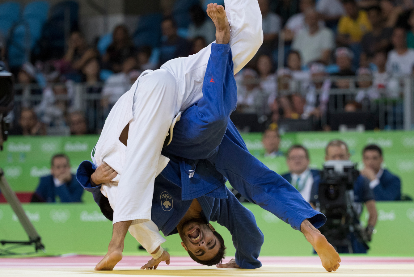 Canada's Antoine Bouchard battles with Tumurkhuleg Daaadorj of Mongolia for a spot in the bronze medal match in the Men's 66kg Judo compition at the Olympic games in Rio de Janeiro, Brazil, Sunday, August 7, 2016. Bouchard won the match and will advance. COC Photo by Jason Ransom