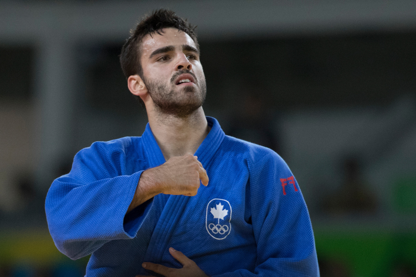 Canada's Antoine Bouchard celebrates his win over Tumurkhuleg Daaadorj of Mongolia for a spot in the bronze medal match in the Men's 66kg Judo compition at the Olympic games in Rio de Janeiro, Brazil, Sunday, August 7, 2016. COC Photo by Jason Ransom