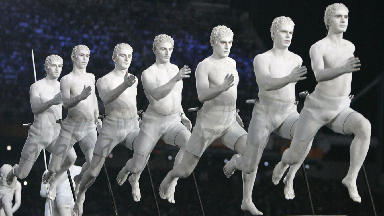 Performers representing figures from Greek mythology enter the stadium during the Opening Ceremony of the 2004 Olympic Games in Athens, Friday Aug. 13, 2004. (AP Photo/Laurent Rebours)