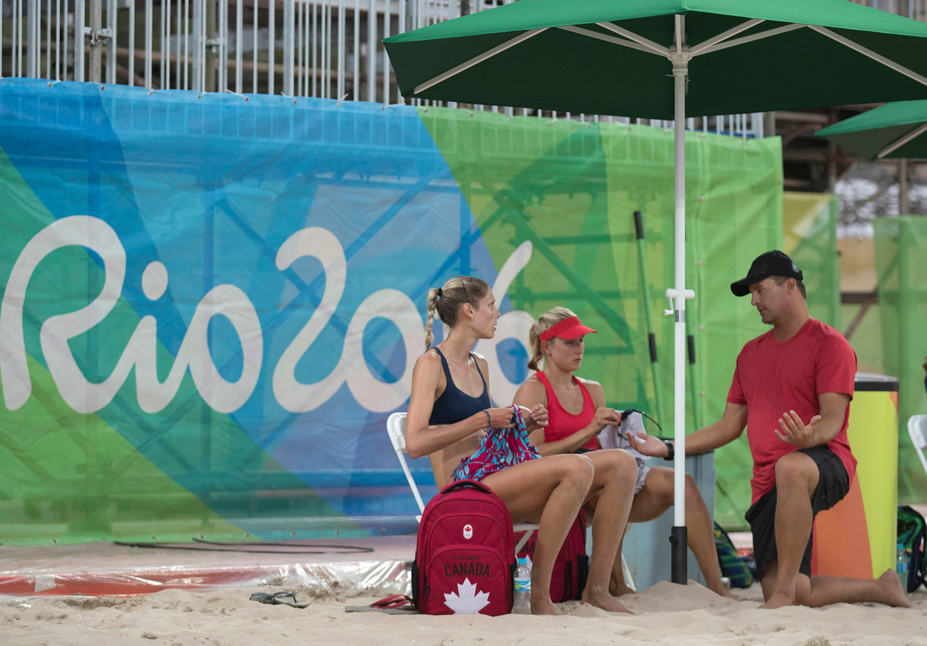 Canadian women's beach volleyball players Heather Bansley, red and Sarah Pavan, black, practice against a Brazilian team at the Olympic games in Rio de Janeiro, Brazil, Friday, July 29, 2016. COC Photo by Jason Ransom