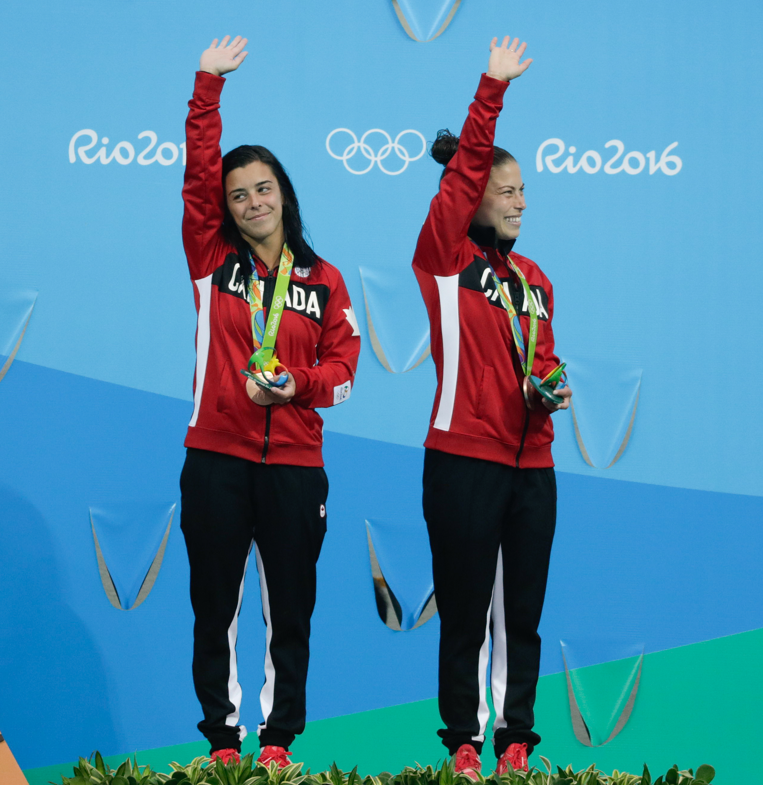 Benfeito and Filion pose with their medals after winning a bronze in the 10m platform synchro dive. (photo/Jason Ransom)