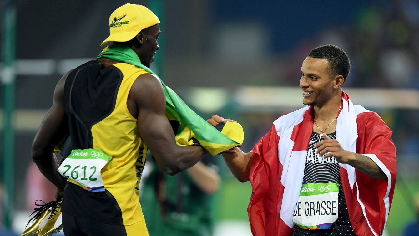 Usain Bolt (left) and Andre De Grasse after their 100m final race at the Olympic Games in Rio de Janeiro on August 14, 2016. 