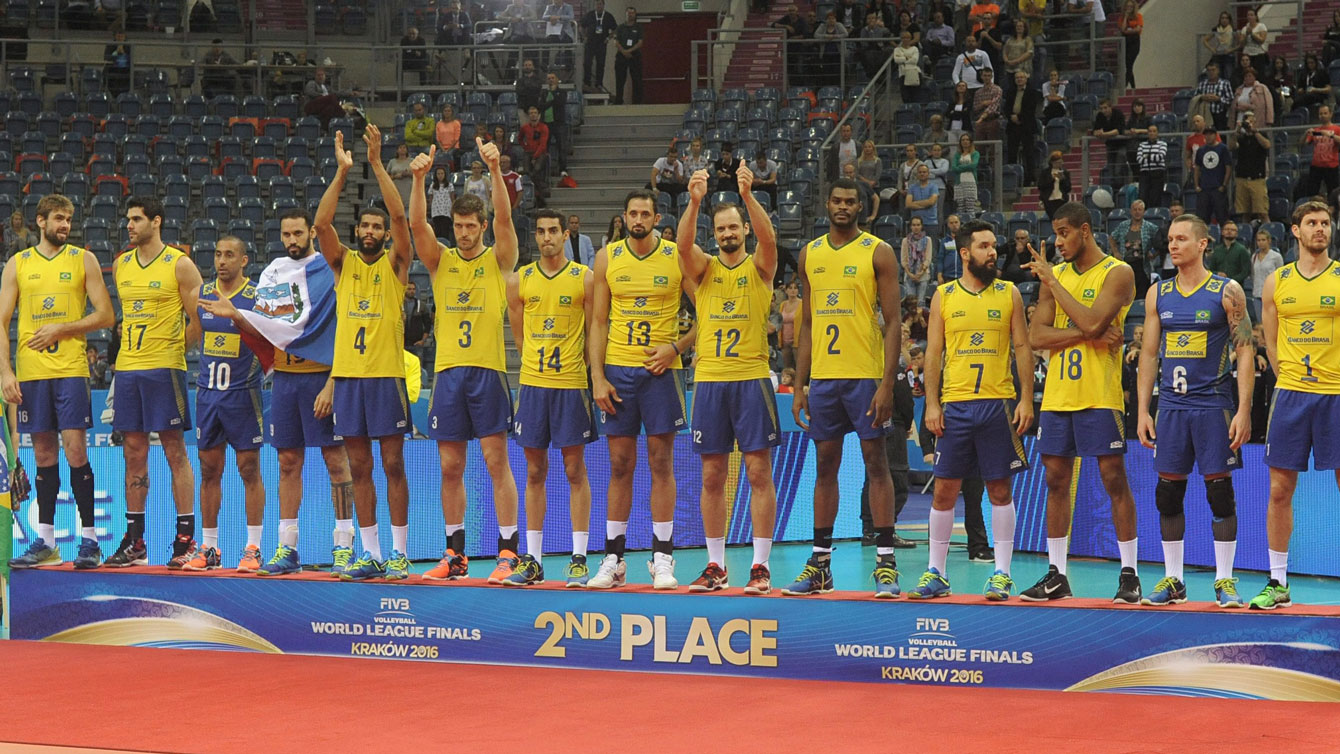 Brazil's players celebrate their second place on the podium during the awarding ceremony of the Volleyball World League Finals, in Krakow, Poland, July 17, 2016. (AP Photo/Alik Keplicz)
