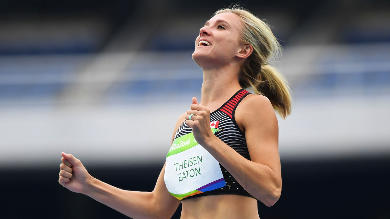 Canada's Brianne Theisen-Eaton, centre, celebrates a successful high jump event during the women's heptathlon at the 2016 Olympic Games in Rio de Janeiro, Brazil on Saturday, Aug. 12, 2016. She won Olympic bronze the next night.