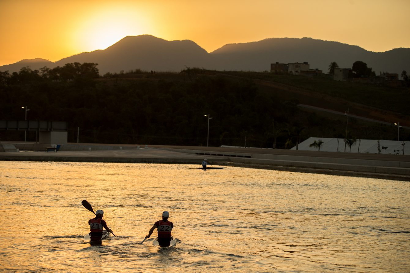 Cam Smedley and Michael Tayler paddle towards the sunset