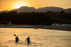 Cam Smedley and Michael Tayler paddle towards the sunset