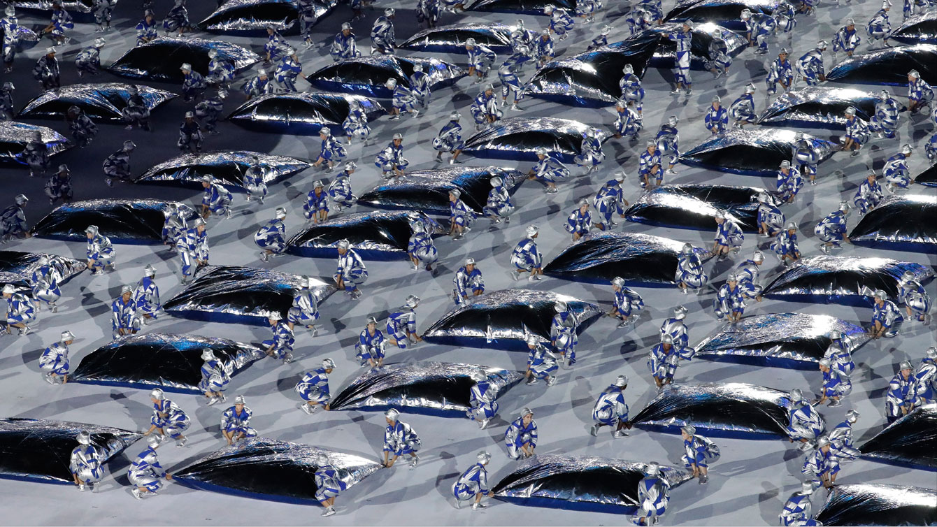 Dancers perform with foils during the opening ceremony for the 2016 Summer Olympics in Rio de Janeiro, Brazil, Friday, Aug. 5, 2016. (AP Photo/Dmitri Lovetsky)