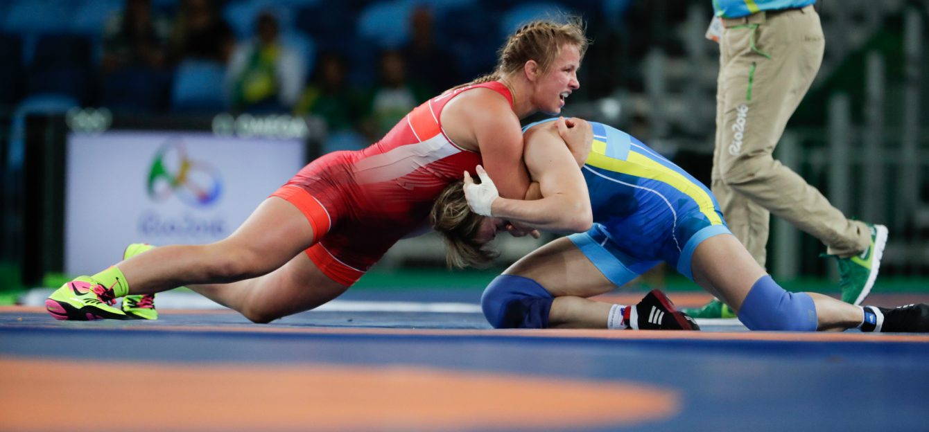 Canada's Erica Elizabeth Wiebe, red, competes against Kazakhstan's Guzel Manyurova during the women's 75kg freestyle wrestling competition at the 2016 Summer Olympics in Rio de Janeiro, Brazil, Thursday, Aug. 18, 2016. (COC/Jason Ransom)