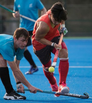 Gabriel Ho-Garcia stick handles past a defender during a friendly match against New Zealand at the Olympic games in Rio de Janeiro, Brazil, Monday, August 1, 2016. COC Photo by Jason Ransom