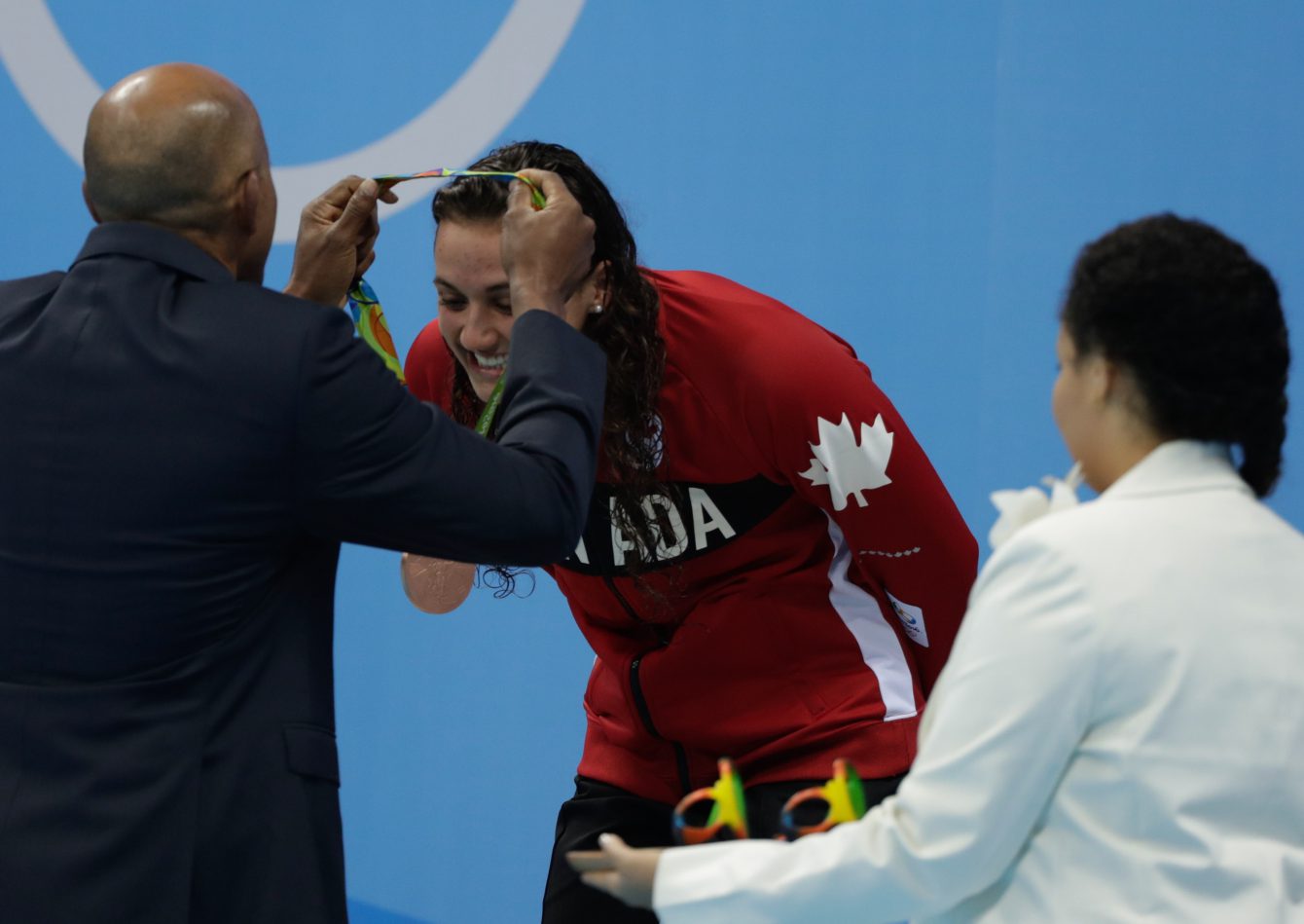 Canada's Kylie Masse being awarded her bronze medal after her 100m backstroke race on August 8, 2016 (photo/Jason Ransom)