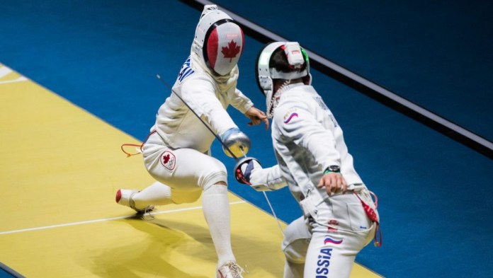 Canada's Maxime Brinck-Croteau competes against Vadim Anokhin of Russia in their Men's Epee Individual Table of 64 fencing match at the Olympic games in Rio de Janeiro, Brazil, Tuesday August 9, 2016. COC Photo/Mark Blinch