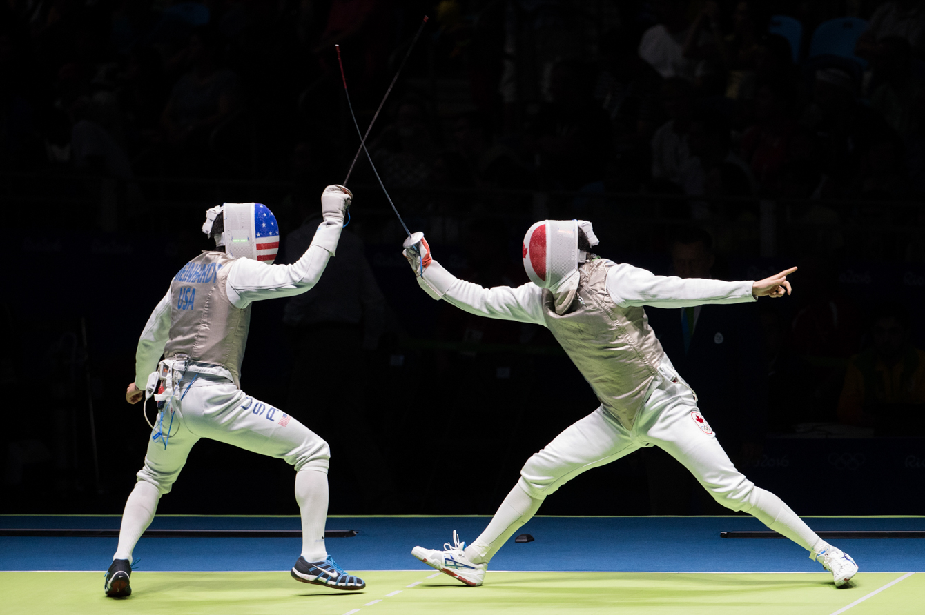 Canada's Maximilien van Haaster, right, competes against against USA's Gerek Meinhardt in their Men's Foil Individual Table of 32 fencing match at the Olympic games in Rio de Janeiro, Brazil, Sunday August 7, 2016. COC Photo/Mark Blinch
