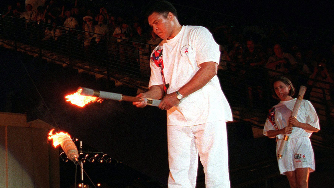 Muhammad Ali lights the Olympic flame during the Atlanta 1996 Opening Ceremony (AP Photo/Michael Probst)