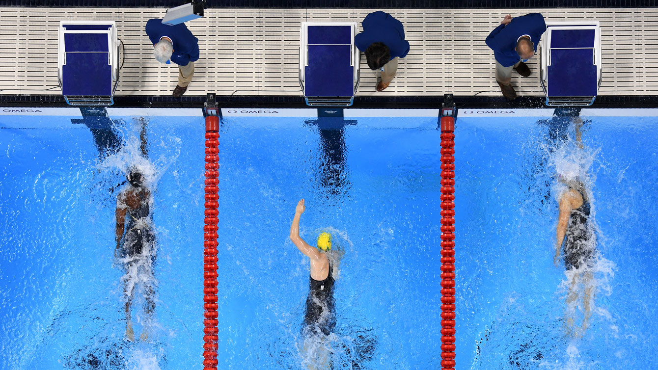 Penny Oleksiak (right) and Simone Manuel (left) touch the wall simultaneously in the 100m freestyle at the Olympic Games in Rio de Janeiro on August 11, 2016. 