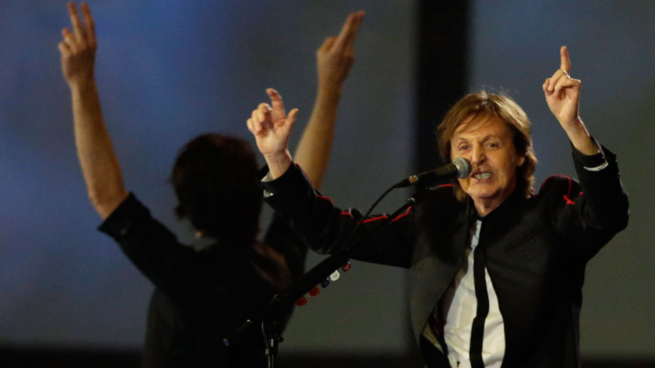 Sir Paul McCartney performs during the London 2012 Opening Ceremony. (AP Photo/Mark Humphrey)