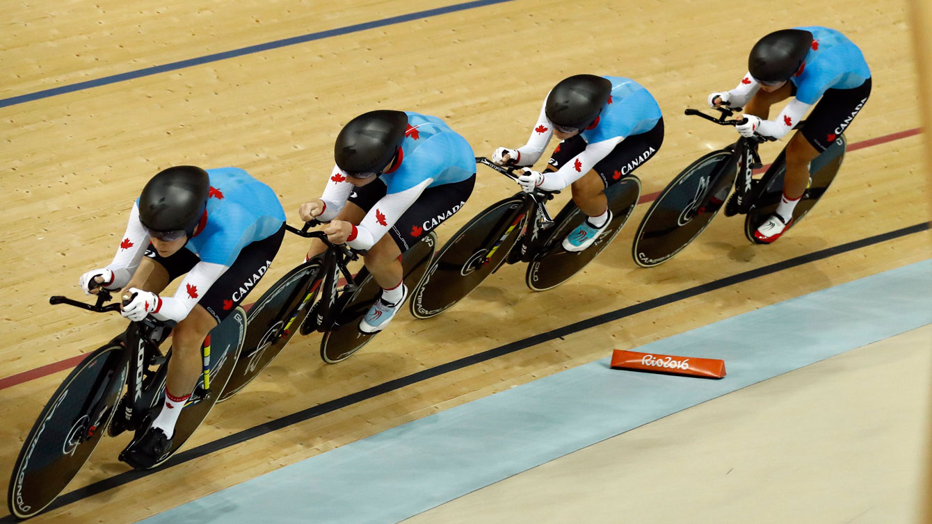Canada's team compete in the women's team pursuit first round at the Rio Olympic Velodrome during the 2016 Summer Olympics in Rio de Janeiro, Brazil, Saturday, Aug. 13, 2016. (AP Photo/Patrick Semansky)