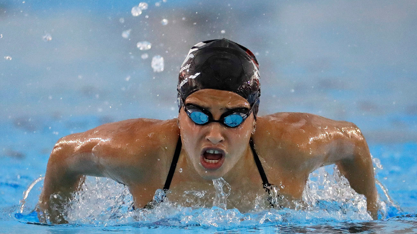 Olympic refugee team member Yusra Mardini swims practice laps at the Olympic Aquatics Stadium ahead of the Rio Olympics in Rio de Janeiro, Brazil, Thursday, July 28, 2016. Mardini is one of ten athletes on the first ever refugee team having fled war-torn Syria. (AP Photo/Charlie Riedel)