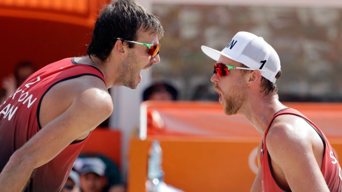 Chaim Schalk and Ben Saxton celebrate the victory over Brazil at the Rio 2016 beach volleyball tournament, August 9, 2016 / AP Photo/Marcio Jose Sanchez