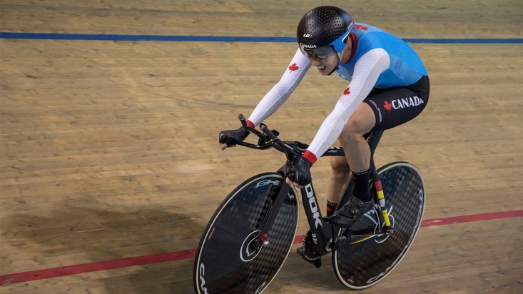 Simmerling racing on bike in velodrome