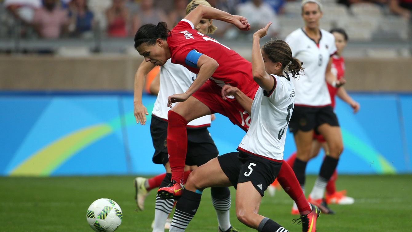 Christine Sinclair tries to get through two German defenders in an Olympic semifinal match for Canada on August 16, 2016.