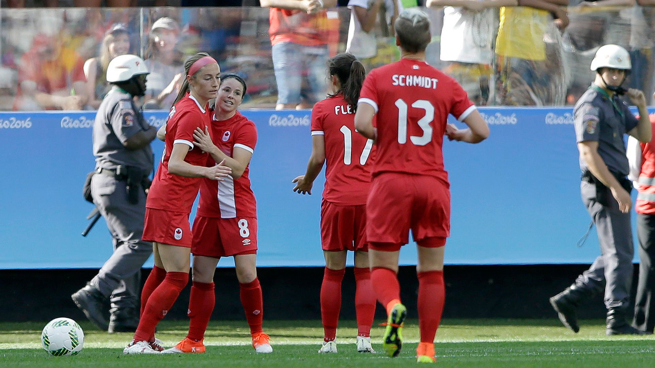 Canada's Janine Beckie, left, celebrates with teammates after scoring her team's first goal during a group B match of the women's Olympic football tournament between Canada and Zimbabwe in Sao Paulo, Brazil, Saturday, Aug. 6, 2016. (AP Photo/Nelson Antoine)