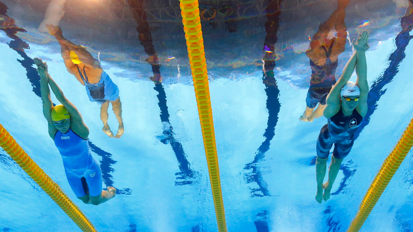 Sweden's Sarah Sjostrom, left, and Canada's Penny Oleksiak compete in a semifinal of the women's 100-meter butterfly during the swimming competitions at the 2016 Summer Olympics, Saturday, Aug. 6, 2016, in Rio de Janeiro, Brazil. (AP Photo/David J. Phillip)