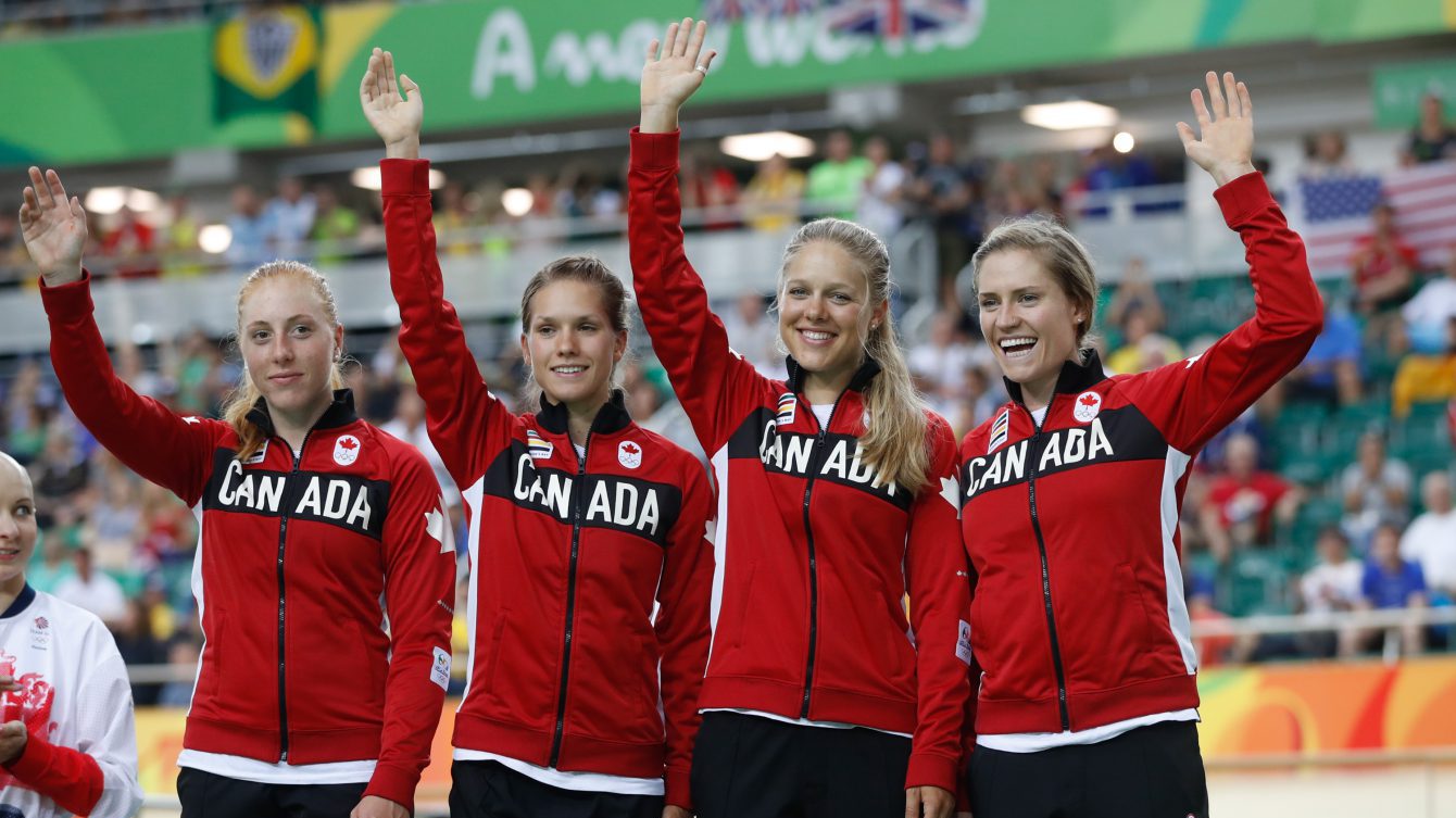 Canada's women's team pursuit team Allison Beveridge, Jasmin Glaesser, Kirsti Lay, and Georgia Simmerling await their bronze medals at the velodrome at the Olympic games in Rio de Janeiro, Brazil, Saturday August 13, 2016.  (photo/ Mark Blinch)