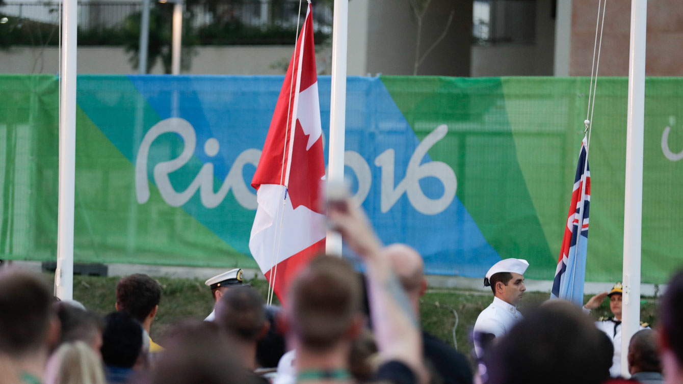 The maple leaf goes up at the Olympic village welcoming ceremony on August 2, 2016 (Jason Ransom/COC). 