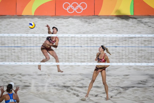 Team Canada's women's beach volleyball duo, Kristina Valjas and Jamie Broder, battle in a preliminary match against Italy, Copacabana Beach, Rio de Janeiro, Brazil, Sunday August 7, 2016. COC Photo/David Jackson