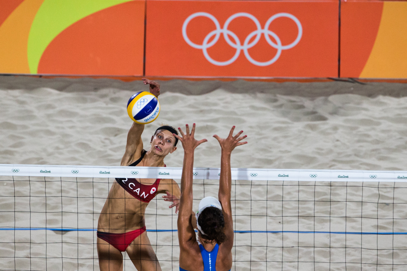Team Canada's women's beach volleyball duo, Kristina Valjas and Jamie Broder, battle in a preliminary match against Italy, Copacabana Beach, Rio de Janeiro, Brazil, Sunday August 7, 2016. COC Photo/David Jackson