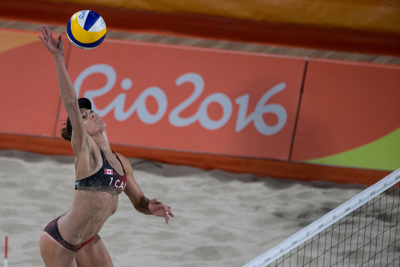 Team Canada's women's beach volleyball duo, Kristina Valjas and Jamie Broder, battle in a preliminary match against Italy, Copacabana Beach, Rio de Janeiro, Brazil, Sunday August 7, 2016. COC Photo/David Jackson