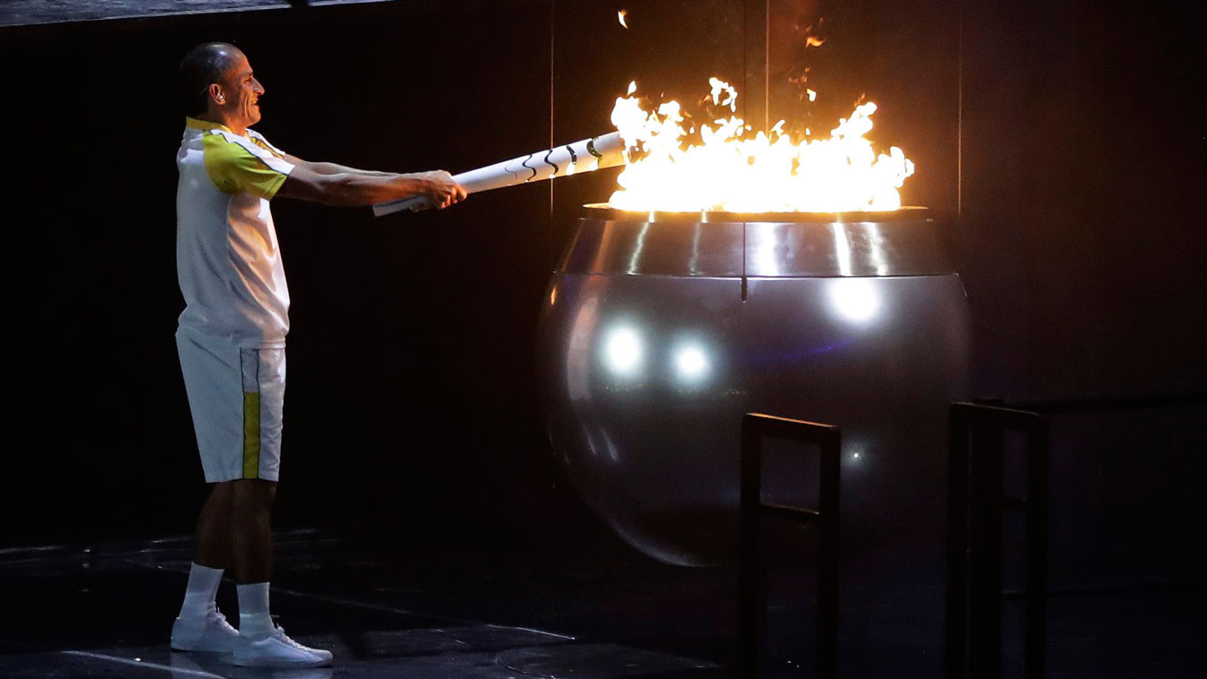 Vanderlei Cordeiro de Lima lights the Olympic flame during the opening ceremony for the 2016 Summer Olympics in Rio de Janeiro, Brazil, Friday, Aug. 5, 2016. (AP Photo/Jae C. Hong)