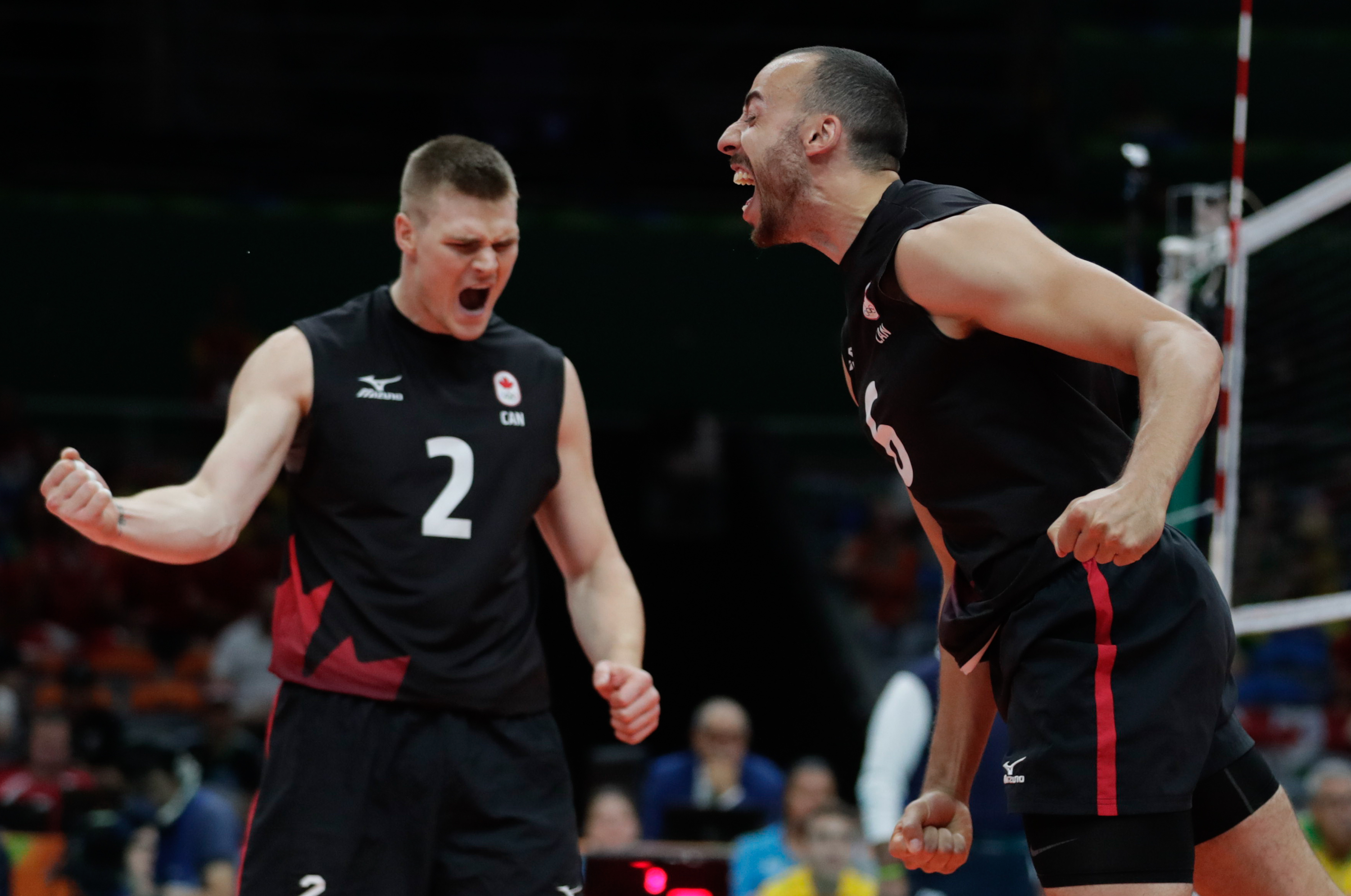 Gord Perrin (left) and Justin Duff during Canada's quarterfinal of the men's volleyball tournament at Rio 2016 (COC/Jason Ransom)