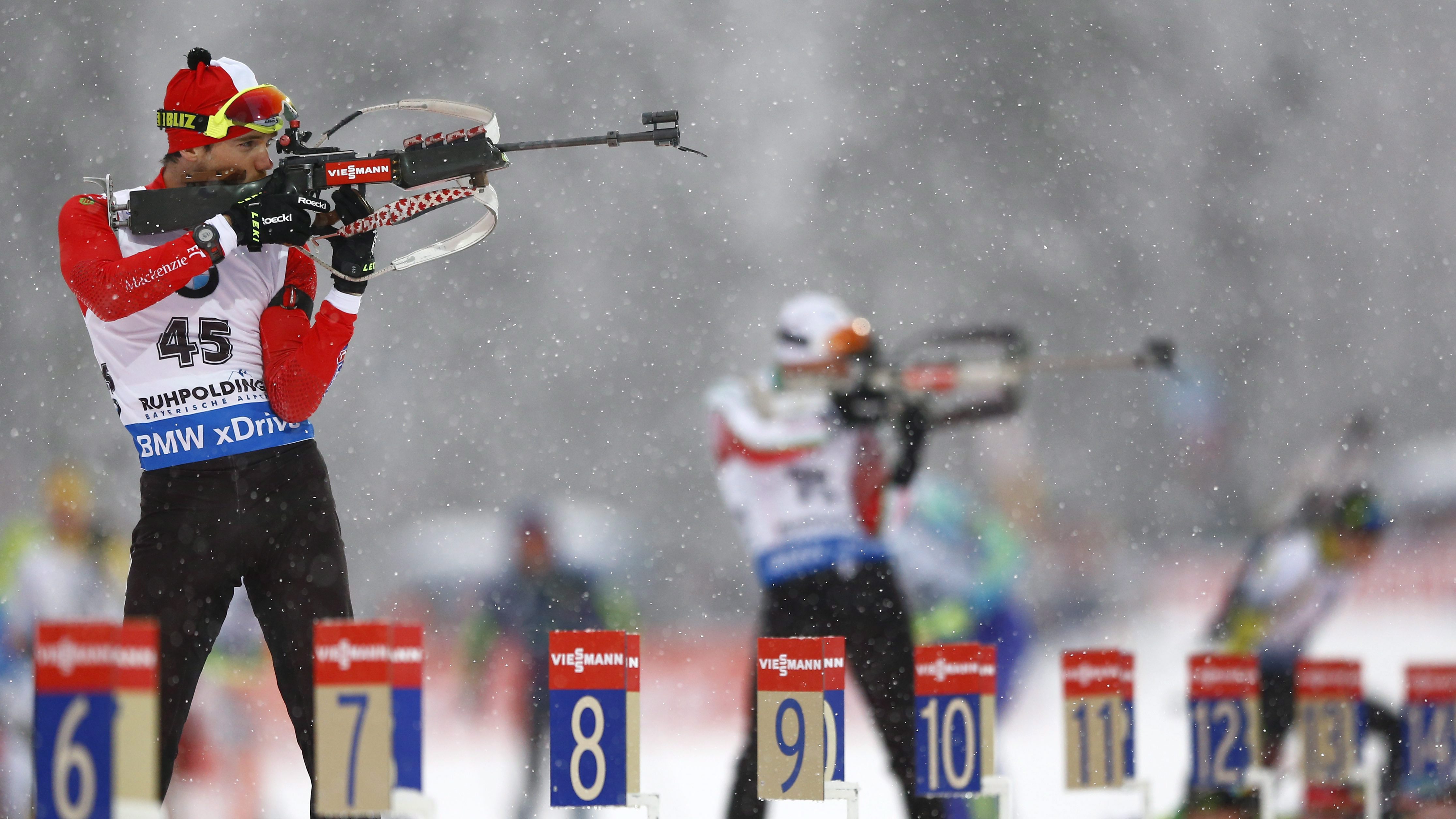 Canada's Nathan Smith shoots at the men's Individual 20 km competition at the Biathlon World Cup in Ruhpolding, Germany, Wednesday, Jan. 13, 2016. (AP Photo/Matthias Schrader)