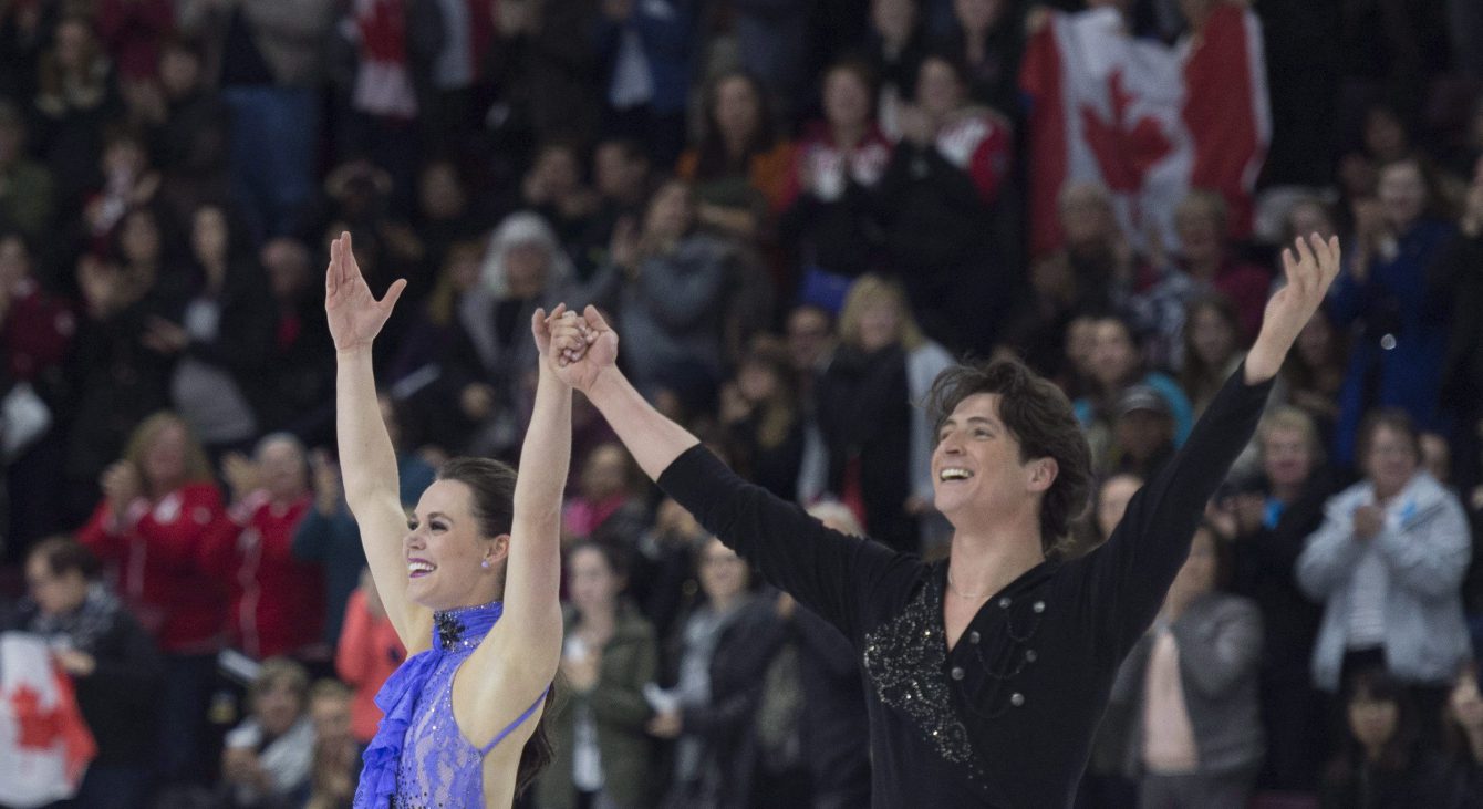 Tessa Virtue and Scott Moir of Canada perform in the ice dance short program during the 2016 Skate Canada International competition in Mississauga, Ont., on Friday, October 28, 2016. THE CANADIAN PRESS/Nathan Denette