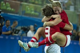 Kayla Moleschi jumps into Ghislaine Landry's arms with excitement after capturing bronze at Rio 2016 (Photo: Paige Stewart).
