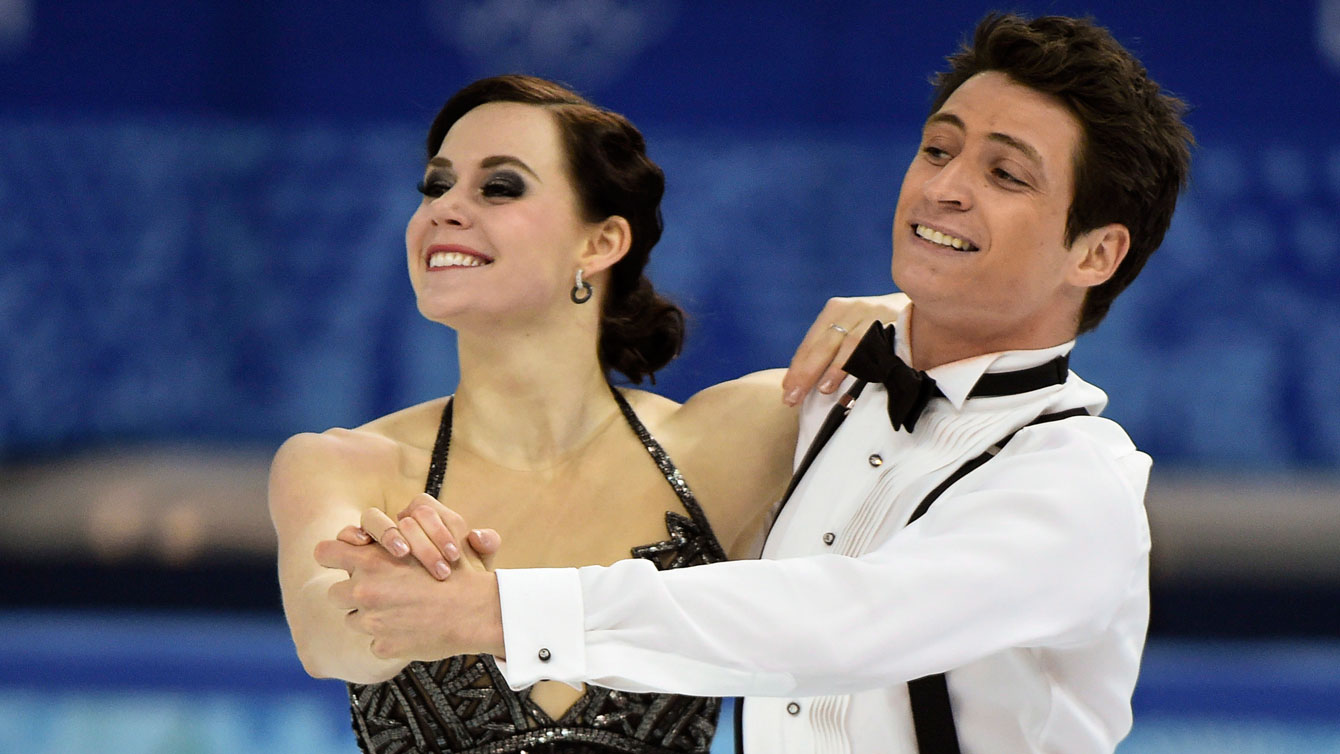 Canada's Tessa Virtue and Scott Moir perform their short dance in the ice dance competition at the Sochi Winter Olympics Sunday, February 16, 2014 in Sochi. THE CANADIAN PRESS/Paul Chiasson