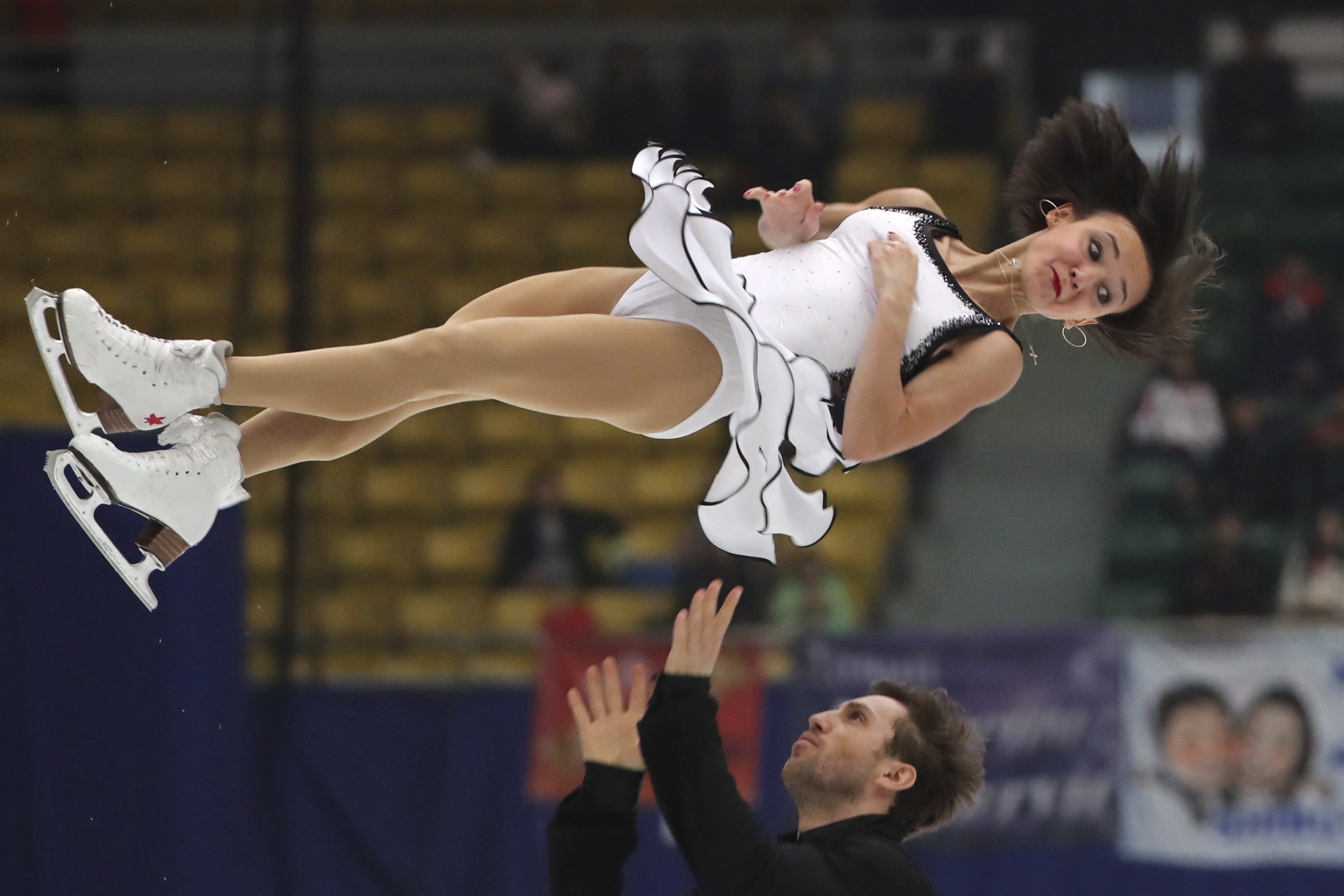 Lubov Ilyushechkina and Dylan Moscovitch of Canada compete in the Pairs Short Program during the Audi Cup of China ISU Grand Prix of Figure Skating 2016 held in Beijing's Capital Gymnasium on Friday, Nov. 18, 2016. (AP Photo/Ng Han Guan)