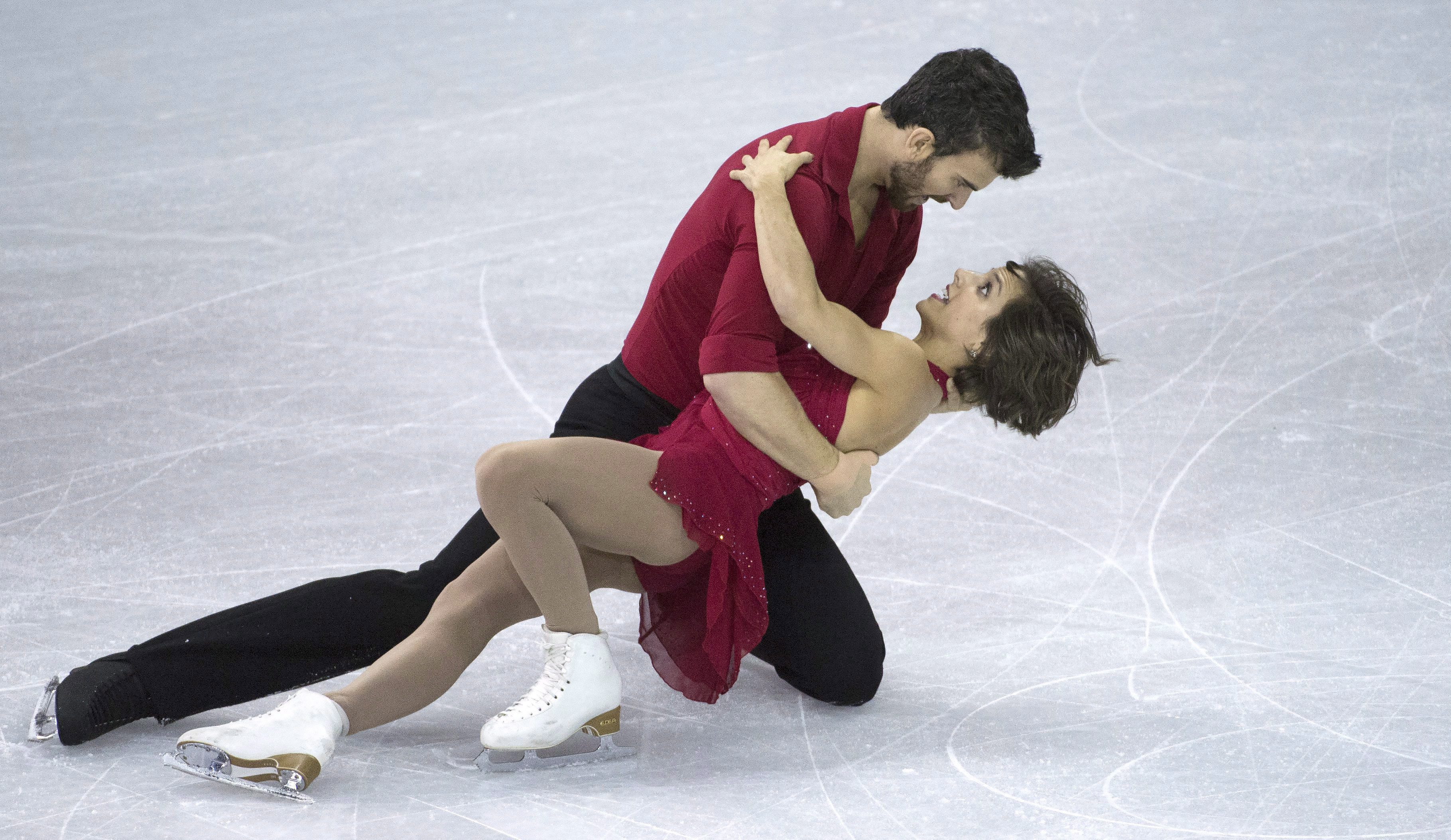 Meagan Duhamel and Eric Radford, of Canada, at the end of their short program at Skate Canada International in Lethbridge, Alta., on Friday, Oct. 30, 2015. THE CANADIAN PRESS/Jonathan Hayward