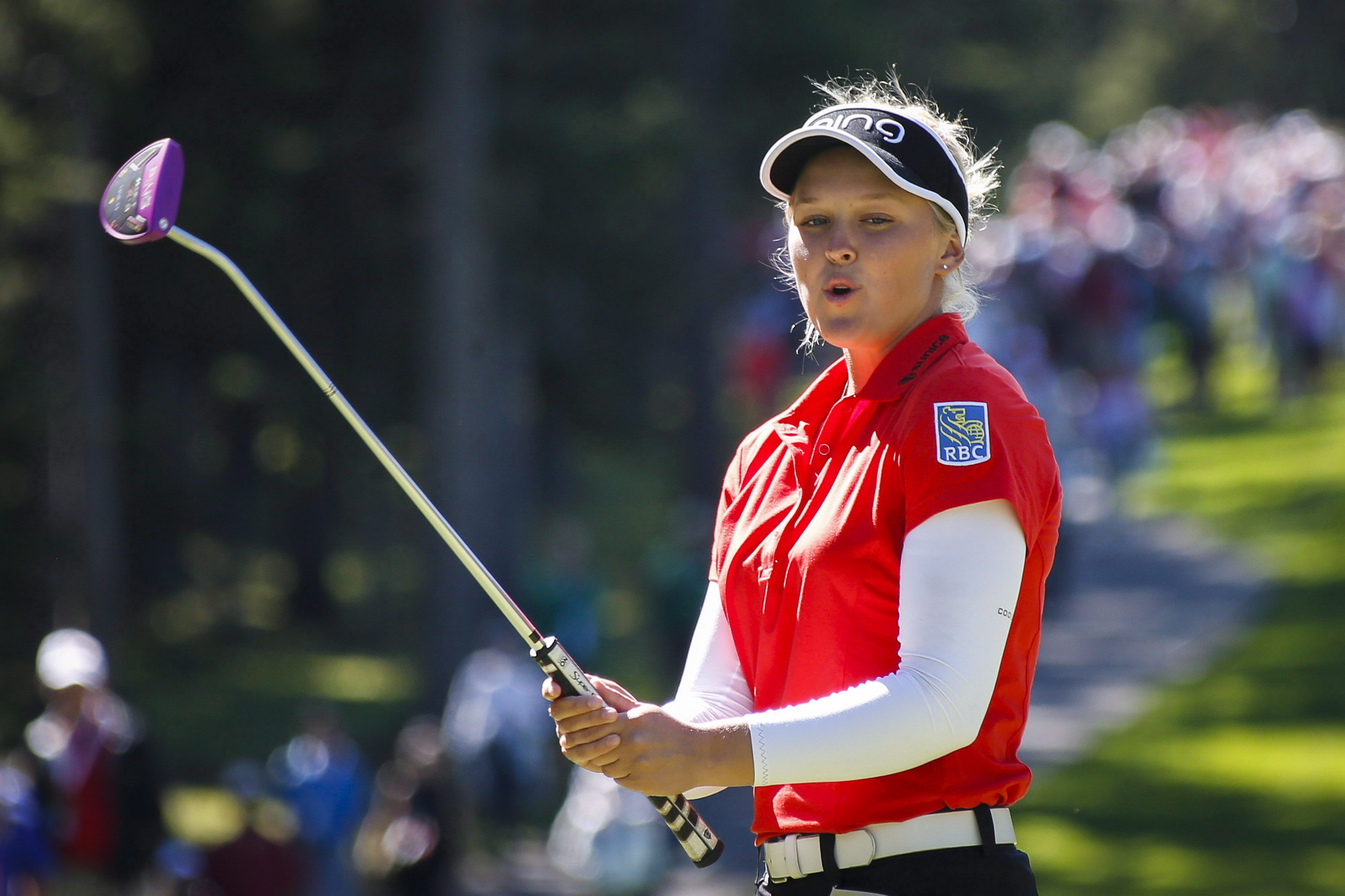 Canada's Brooke Henderson tries to coax her putt into the cup during second round action at the LPGA Canadian Open tournament in Priddis, Alta., Friday, Aug. 26, 2016. THE CANADIAN PRESS/Jeff McIntosh