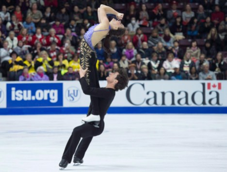 FIG Skate Canada 20161028 Tessa Virtue and Scott Moir of Canada perform in the ice dance short program during the 2016 Skate Canada International competition in Mississauga, Ont., on Friday, October 28, 2016. THE CANADIAN PRESS/Nathan Denette
