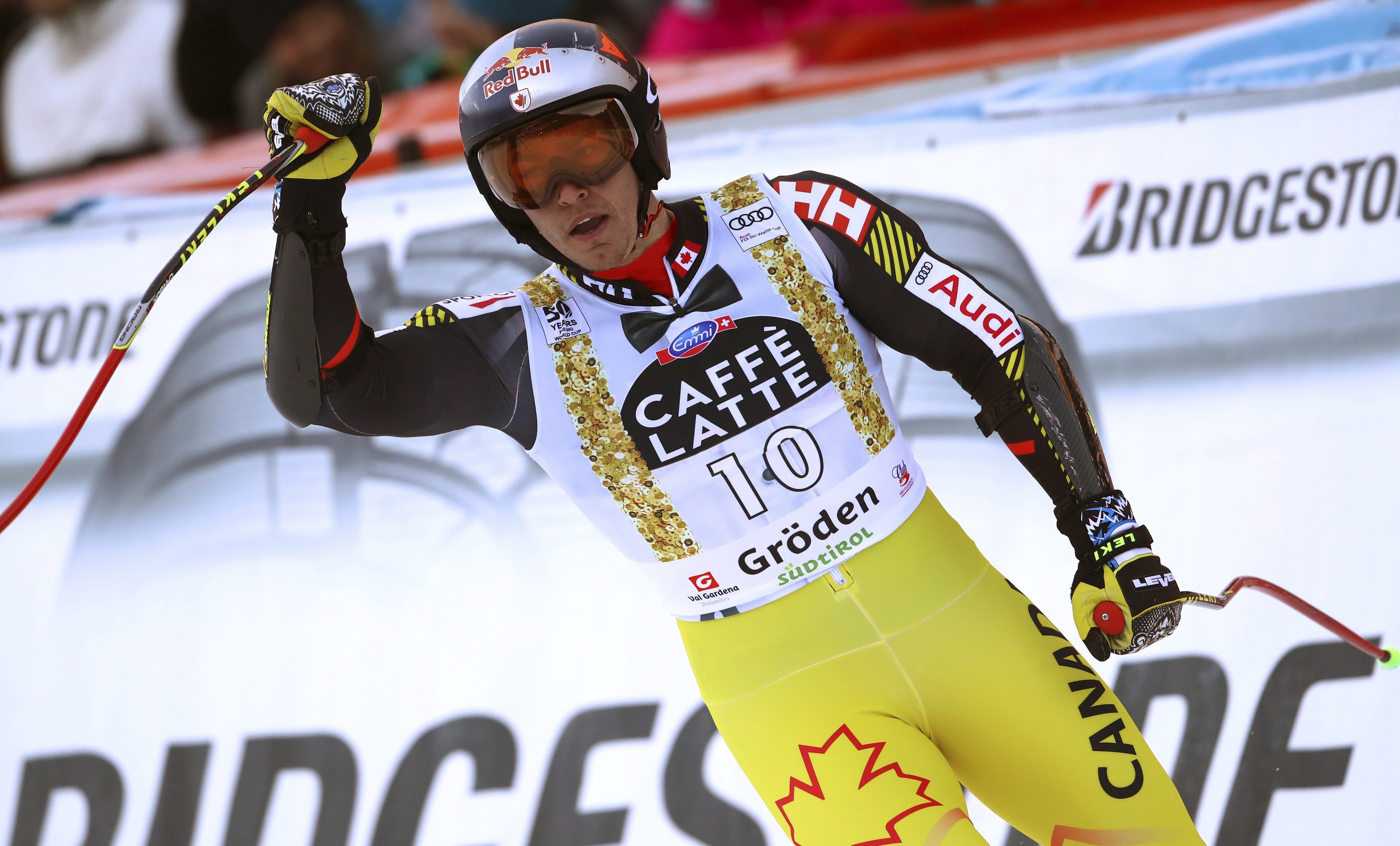 Canada's Erik Guay celebrates after completing an alpine ski, men's World Cup super-G, in Val Gardena, Italy, Friday, Dec. 16, 2016. (AP Photo/Alessandro Trovati)