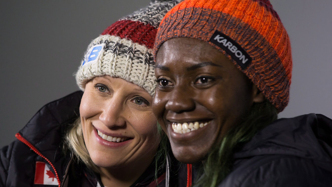 Kaillie Humphries and Cynthia Appiah pose after racing to World Cup gold in Whistler on December 3, 2016. THE CANADIAN PRESS/Darryl Dyck