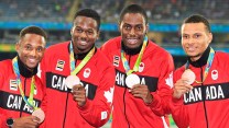 (L-R) Akeem Haynes Aaron Brown, Brendon Rodney and Andre De Grasse show off their 4x100m bronze medals at Rio 2016 on August 20, 2016. THE CANADIAN PRESS/Frank Gunn