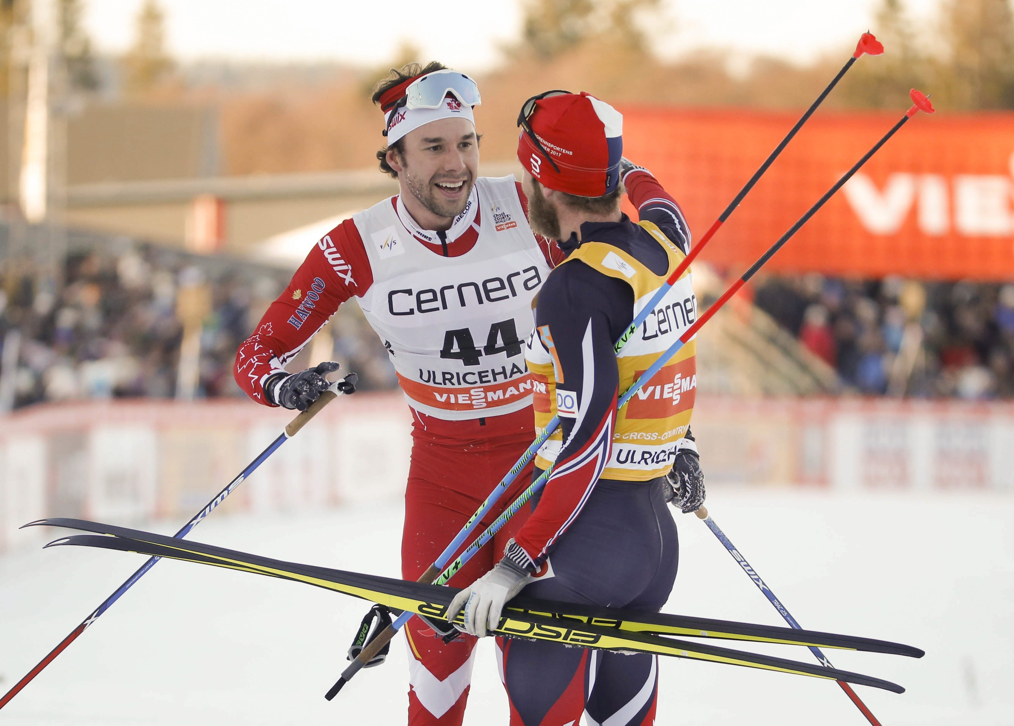 Alex Harvey of Canada, left, is congratulated by Norway's Martin Johnsrud Sundby after winning the men's 15km free style competition at the FIS Cross Country skiing World Cup event in Ulricehamn, Sweden, Saturday Jan. 21, 2017. (Adam Ihse / TT via AP)