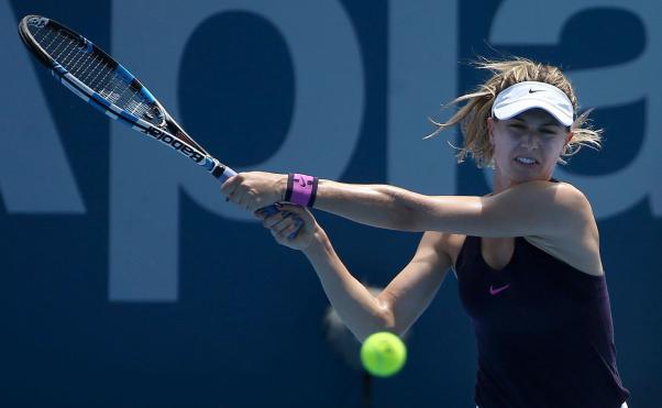 Eugenie Bouchard returns a ball against Slovakia's Dominika Cibulkova in the second round of the Sydney Tournament on January 10th, 2017. (AP Photo/Rick Rycroft)