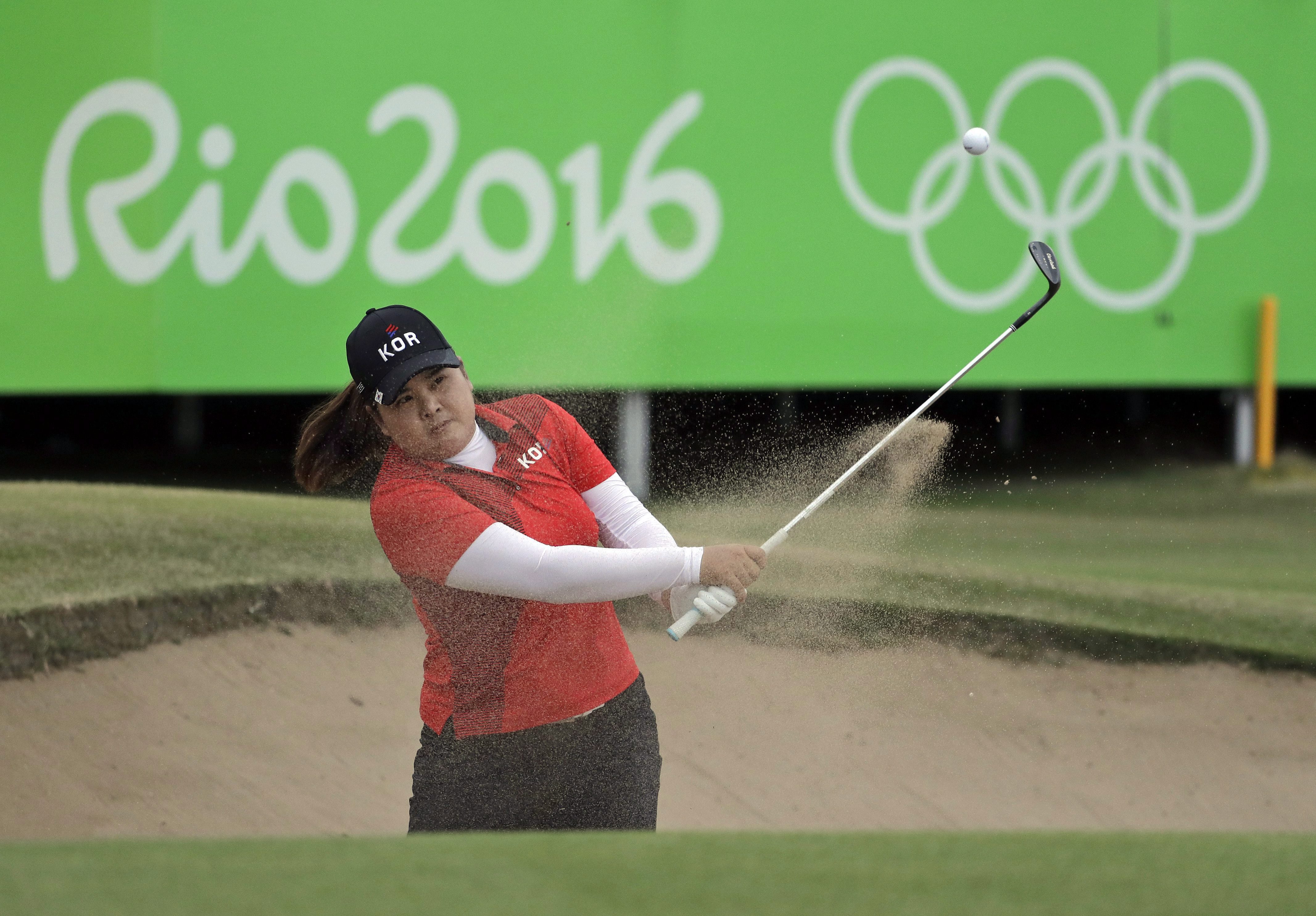 Inbee Park of South Korea, hits from the bunker on the 18th hole during the final round of the women's golf event at the 2016 Summer Olympics in Rio de Janeiro, Brazil, Saturday, Aug. 20, 2016. Park won the gold medal. (AP Photo/Chris Carlson)