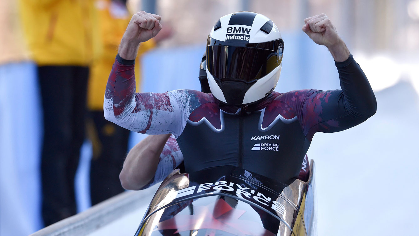 Justin Kripps and Jesse Lumsden celebrate their second place in two-man at the Bobsleigh World Championships at Koenigssee, Germany, on Feb. 19, 2017. (Angelika Warmuth/dpa via AP)