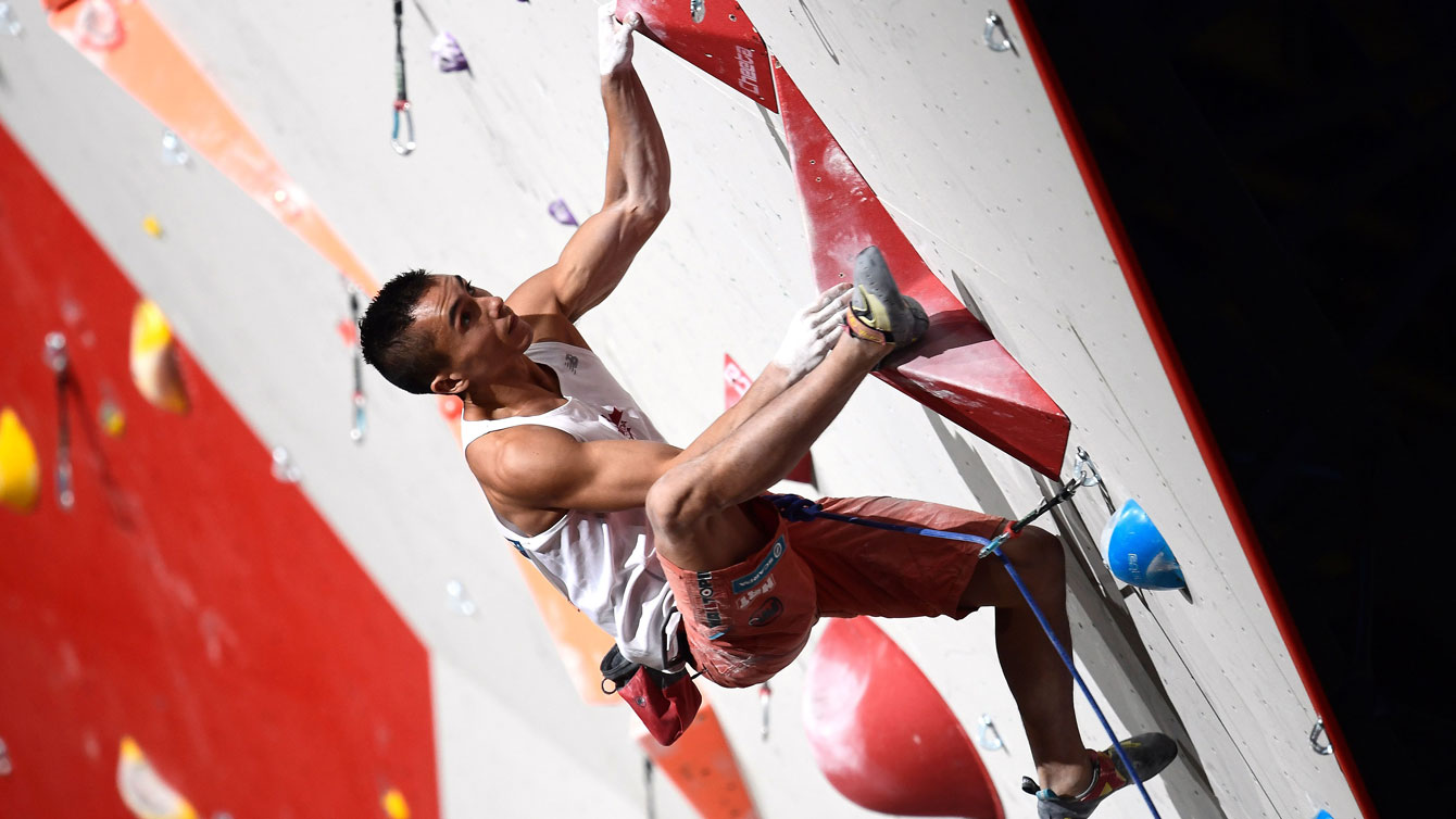 Sean McColl competes in lead climbing